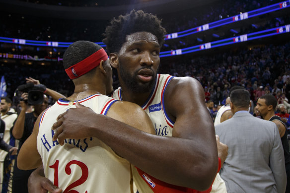 Joel Embiid hugs Tobias Harris after the 76ers' win.