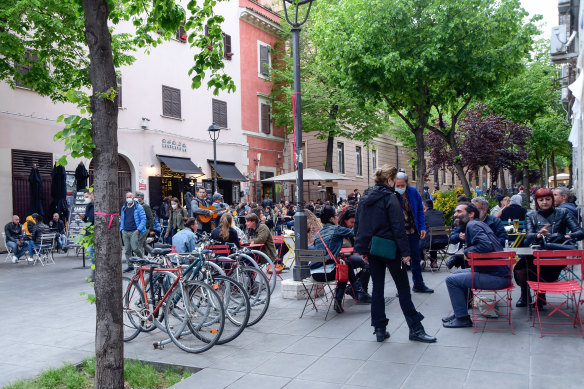 Locals gather in the Via del Pigneto.