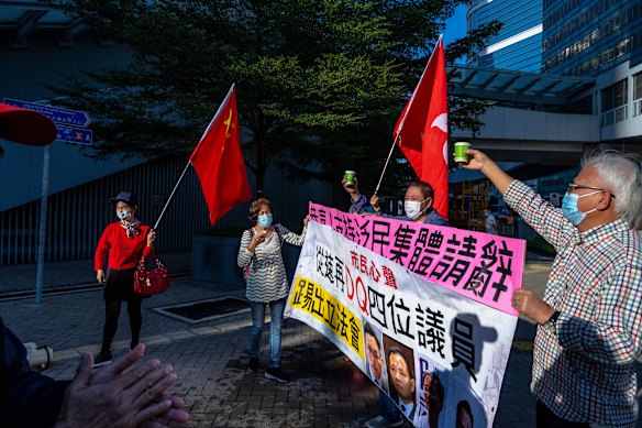 Pro-Beijing supporters outside the legislature's building in Hong Kong on Wednesday.