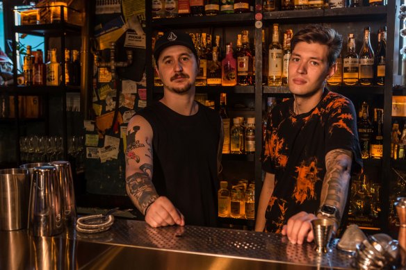 Bartenders Pavlo Lavrukhin, left, and Oleksii Rosynskyi, at Squat 17B bar in Kyiv, Ukraine.