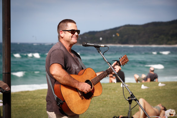 Fintan Callaghan busking to supplement his part disability pension and sporadic work as a musician.