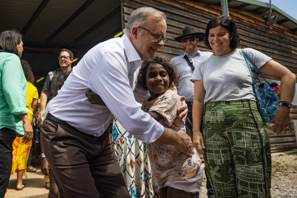Prime Minister Anthony Albanese embraces a Yolngu child during the Garma Festival in East Arnhem Land on the weekend. 