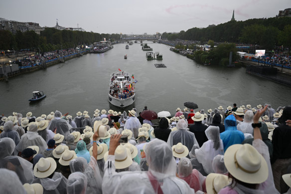 Boats carrying members of Olympic delegations sail along the Seine. Heavy rain during the opening ceremony revived concerns over the long-polluted waterway.