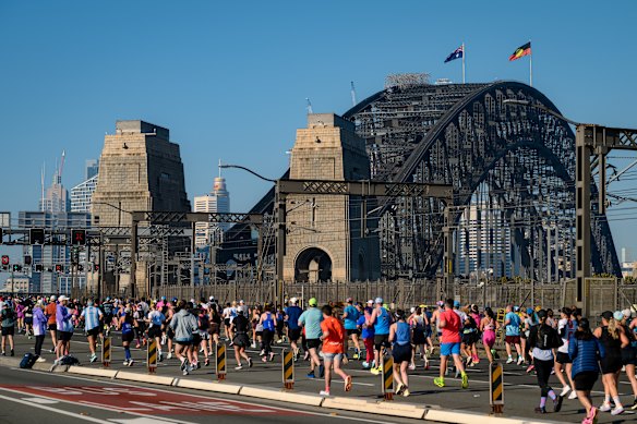 Thousands of runners cross the Sydney Harbour Bridge for the marathon.