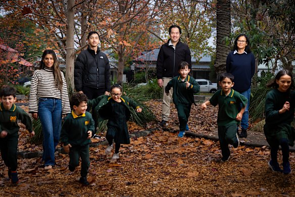 Abbotsford Primary School parents with their children. From left: Lorena Burns with Ben, 7, and Tom, 5; Ben Luk with Emma, 7; Jieh-Yung Lo with Hopelyn, 7; and Suk-yi Lo with Callum, 8 and Raelyn, 10.