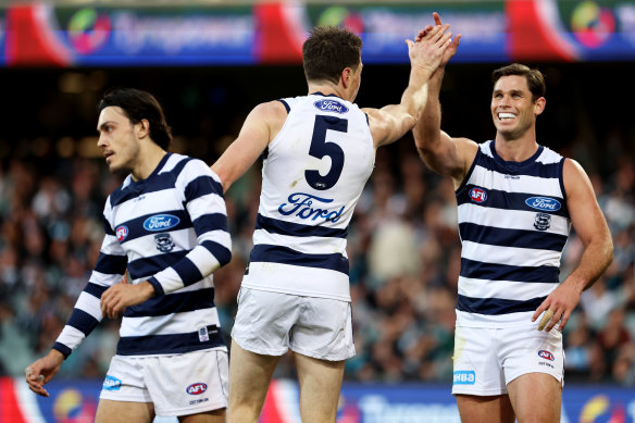 Jeremy Cameron celebrates a goal with Tom Hawkins. The pair have kicked 127 goals between them in 2022. 