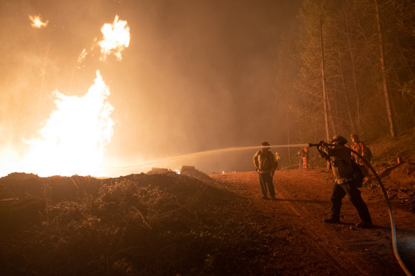 Firefighters try to douse flames in Oroville, California, US.