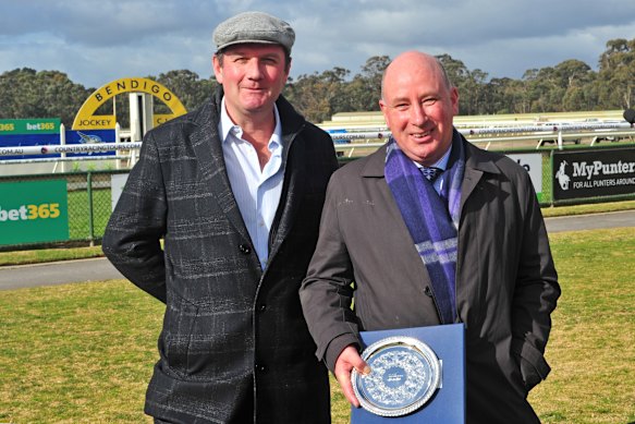 Sandy McGregor (left) with Nick Rule after one of their horses won a race in Bendigo in 2017.