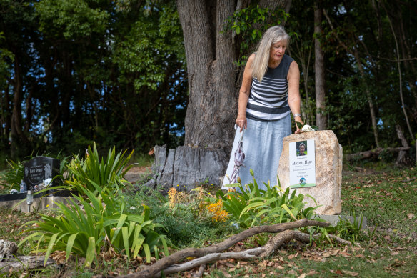 Di Hart visits the burial site of her husband, Michael, at Mullumbimby. Her family made the headstone themselves.