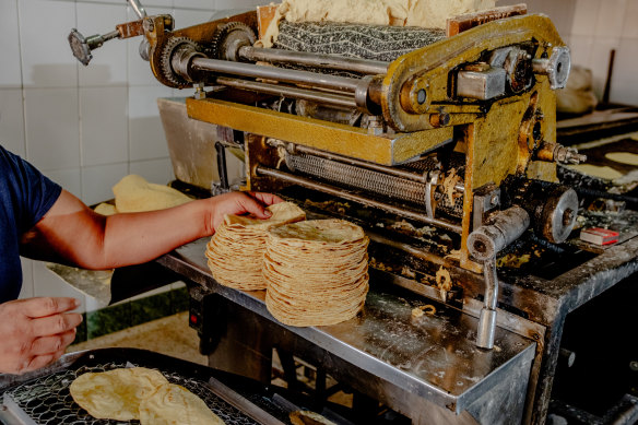 A woman makes tortillas in Mexico City.