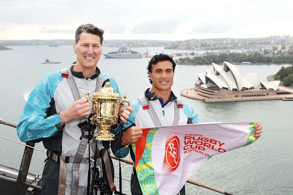 John Eales and Joseph-Aukuso Suaalii on top of the Sydney Harbour Bridge, as part of the 2027 Rugby World Cup fixture list release.