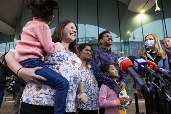 The Murugappan family and “Home to Bilo” campaigner Angela Fredericks speak to the media at Perth Airport.