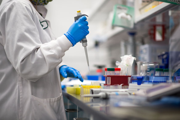 A scientist works on the Pfizer vaccine.