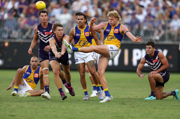 Reuben Ginbey kicks the ball away during Sunday’s western derby, where he stood tall as injury clipped many Eagles’ wings.
