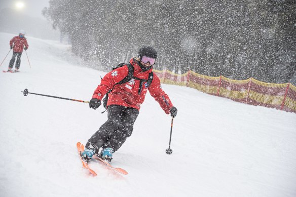 Ski patroller Tess Hoinville was all smiles for the first day of the 2025 winter ski season on Mount Buller.