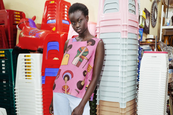 A model wear Obus clothing featuring designs based on the work of Ethiopian-born painter Olana Janfa.