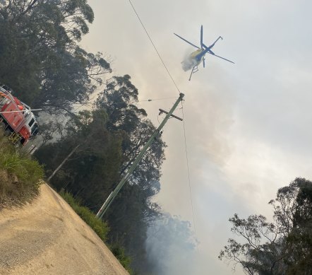 A helicopter tackles the blaze at Murrah on Wednesday.