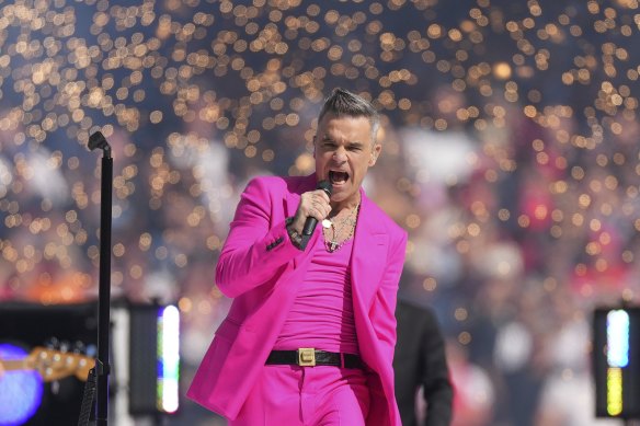 Robbie Williams won over Australian audiences performing at last year’s AFL grand final. 