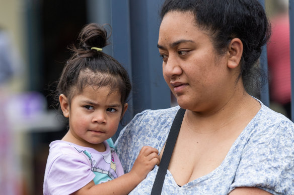 Mary Ameko and daughter Zemirah wait at the Melton food bank.