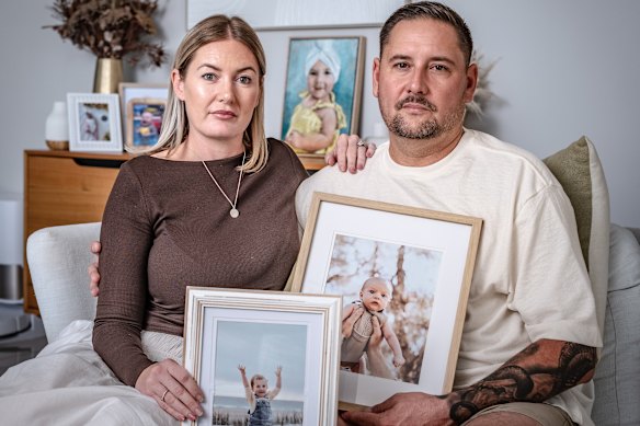 Danielle and Leon Green at home in Western Australia with photos of their children Sonny and Airlie.