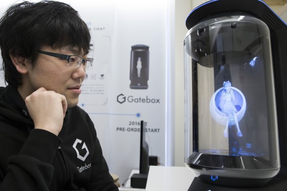 Japanese inventor Minori Takechi with virtual home robot Hikari Azuma.