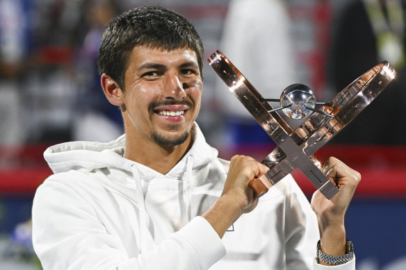 Popyrin with the spoils of his victory.