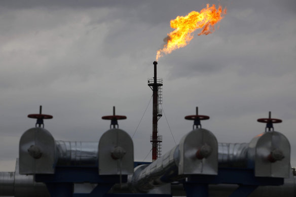 A gas flare burns at the central processing plant for oil and gas in the Salym oilfields near Surgut, Russia.