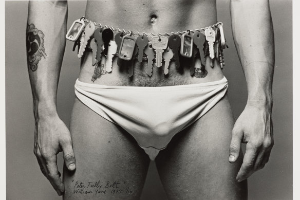 A free exhibition of photos by William Yang at the State Library of NSW includes this image of Roy modelling a belt made by Peter Tully, 1977