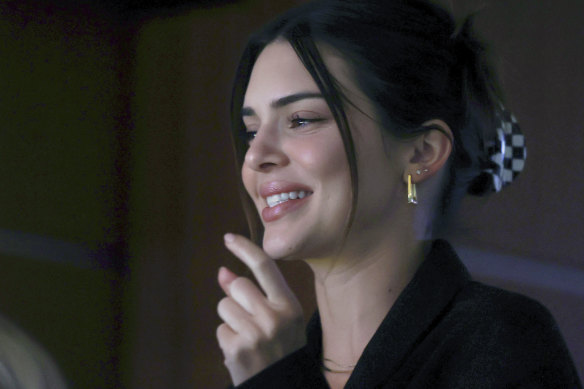 Kendall Jenner and her trusty claw clip at a basketball game in April.
