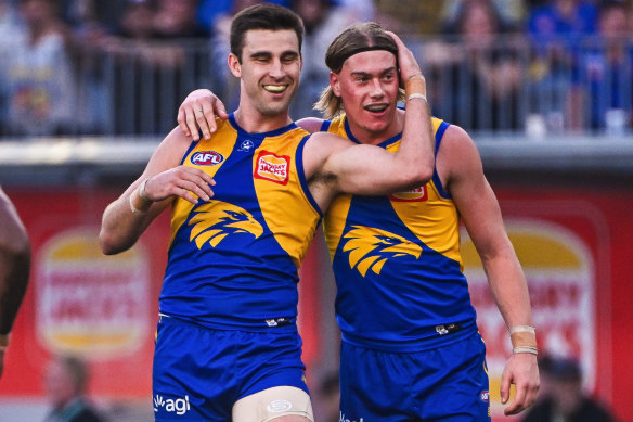 Harley Reid (right) celebrates with Eagles teammate Elliot Yeo.