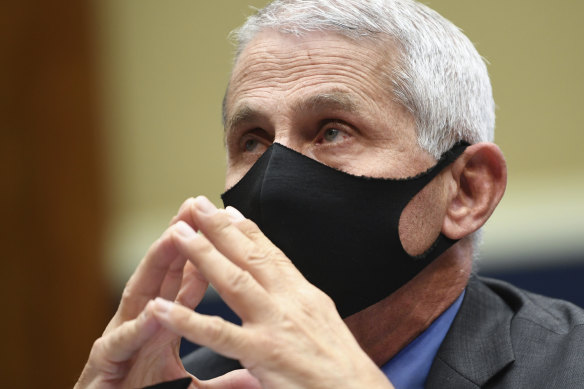 Dr Anthony Fauci wears a face mask as he waits to testify in Washington.