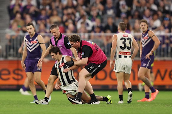 Collingwood’s Lachie Schultz stumbles leaving the field in the round nine match against Fremantle.