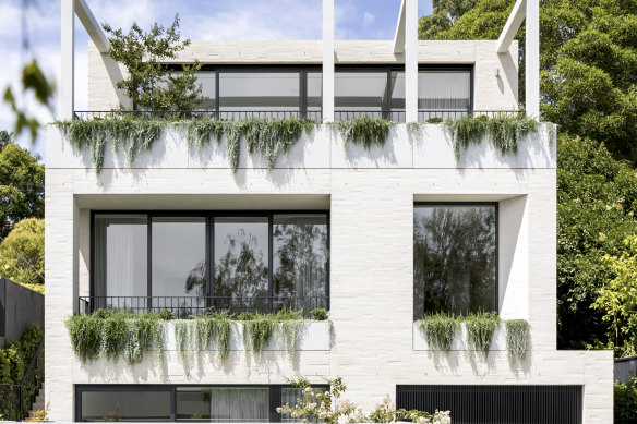 The contemporary new build stands on the former site of an Edwardian brick residence.