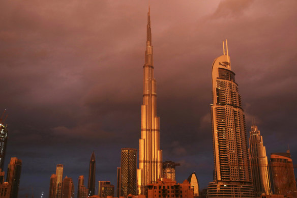 Sunlight reflects off the Burj Khalifa, the world’s tallest building, during a rain shower in Dubai in 2018.
