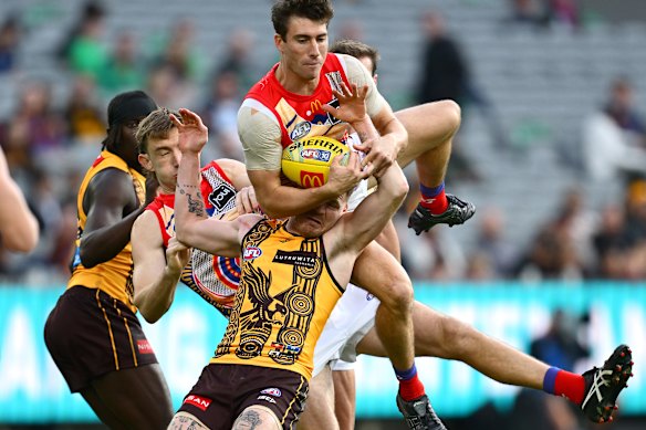 Noah Answerth of the Lions marks over Blake Hardwick of the Hawks.