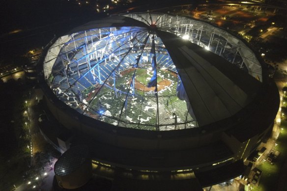 An aerial view of the Tropicana Field stadium roof after it was shredded as Hurricane Milton swept through St Petersburg.