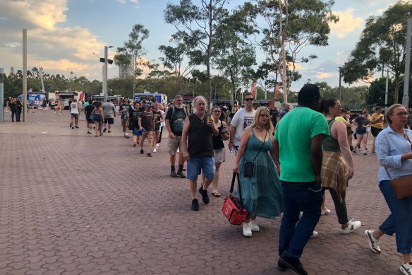 Concert goers arrive at Accor stadium for Foo Fighters.