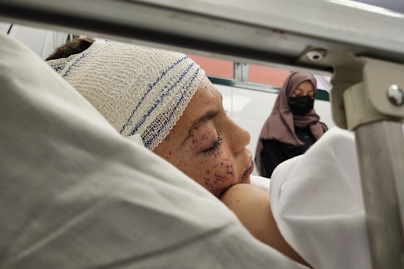 The only surviving child of Doctor Ela al-Najjar lies in a hospital bed.