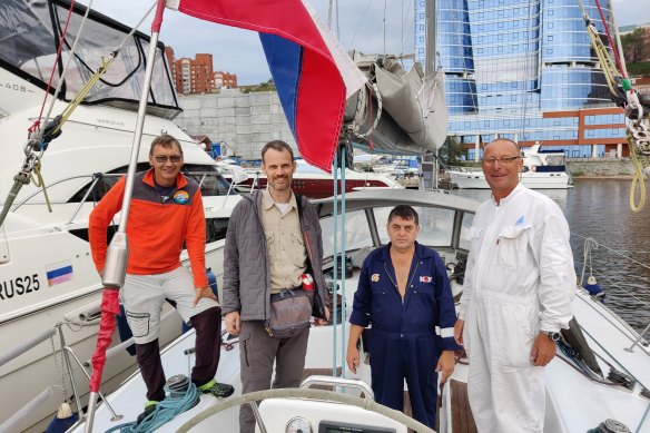 Canadian father Colin Rowat (second from left) sailed from Vladivostok to Fukuoka to see his children in Japan.