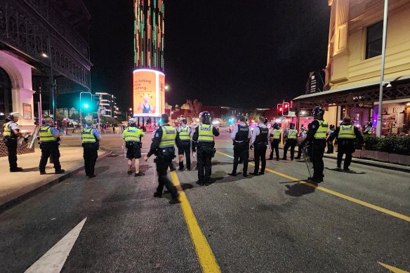 Police in riot gear confront mass fights in Perth’s CBD on Australia Day.