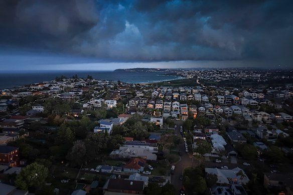 Storms turn day into night over Curl Curl.