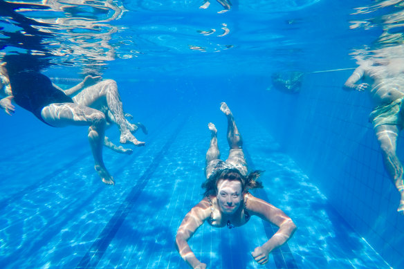 Locals swimming in the pool on Thursday.