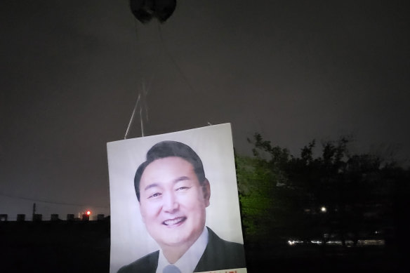 A balloon bearing leaflets and a banner showing an image of South Korea’s president-elect Yoon Suk Yeol is released from the border town of Gimpo, South Korea, on April 25.