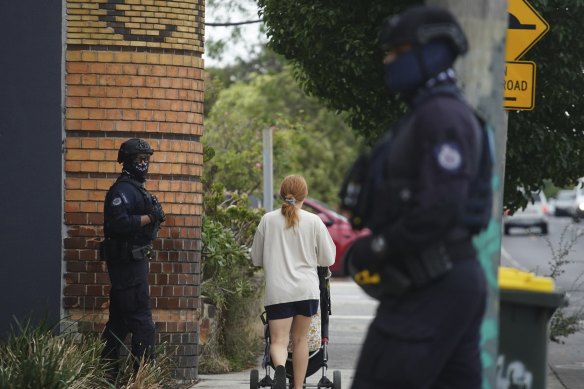 Federal police during the raid the Northcote offices of Charles Pellegrino on Thursday.