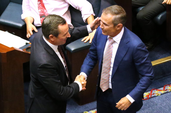 Premier Mark McGowan and Health Minister Roger Cook celebrate on the floor of WA’s Legislative Assembly after the passage of the government’s euthanasia legislation in 2019.