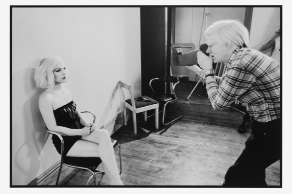 Andy Warhol photographs Debbie Harry. 