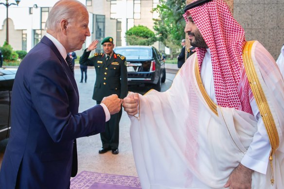 Saudi Crown Prince Mohammed bin Salman, right, greets US President Joe Biden with a fist bump in Jeddah.