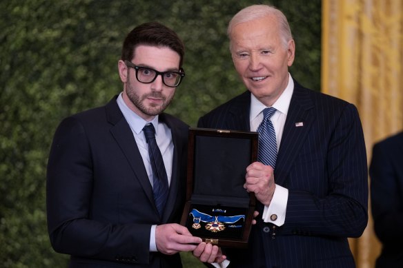Joe Biden (right) and Alex Soros, son of award recipient George Soros, billionaire and founder of Soros Fund Management, with the Medal of Freedom.