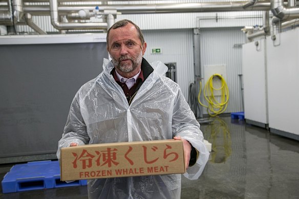 Kristján Loftsson holds a box of frozen whale meat destined for the Japan market.