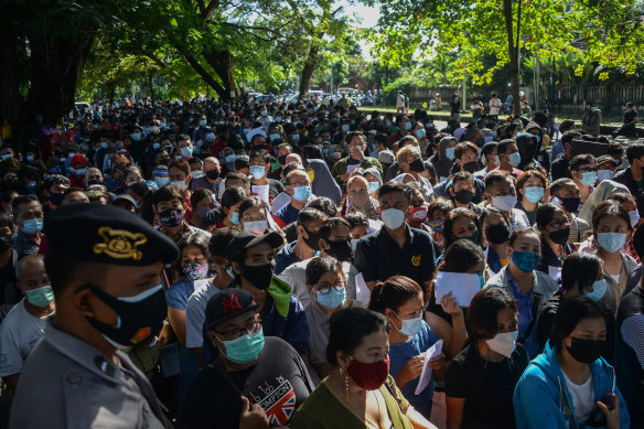 People gather in Denpasar this week to register for the AstraZeneca vaccine.